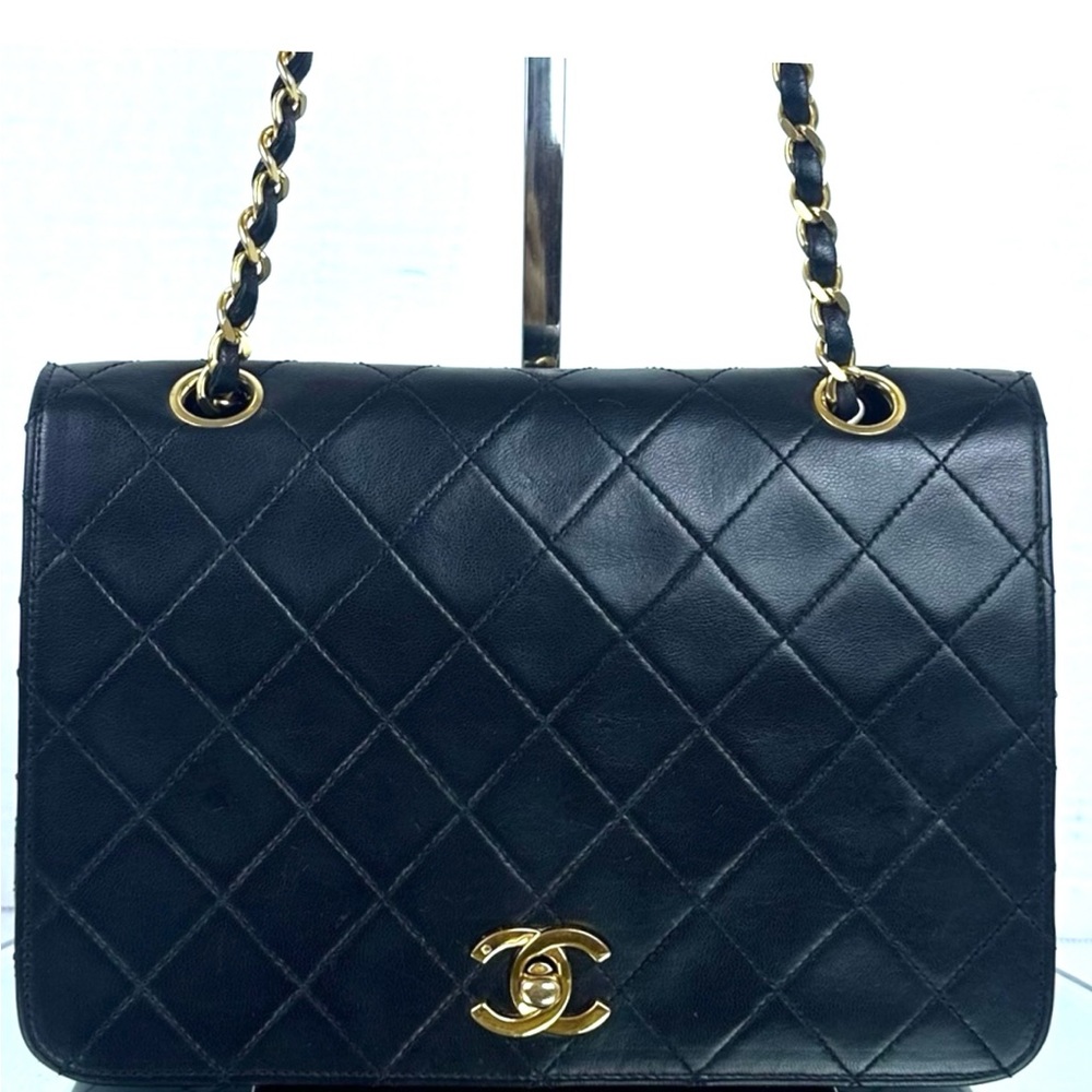 CHANEL Black Quilted Shoulder Bag with Gold Accents